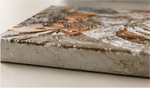 Angled close-up of raised paint texture on canvas